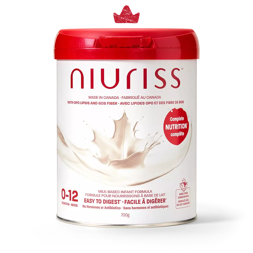 An official product image of a can of Niuriss Infant Formula. A crown hovers above it, representing our quality formulas.